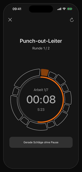 Der laufende Bell-Timer: Punch-out-Leiter, Runde 1 / 2, Arbeit 1/7, 00:08 auf der Uhr, darunter 5:23 und der Hinweis Gerade Schläge ohne Pause