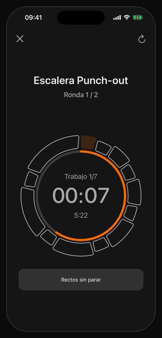 El temporizador de Bell en marcha: Escalera Punch-out, Ronda 1 / 2, Trabajo 1/7, 00:07 en el centro, 5:22 justo debajo y, al pie, Rectos sin parar