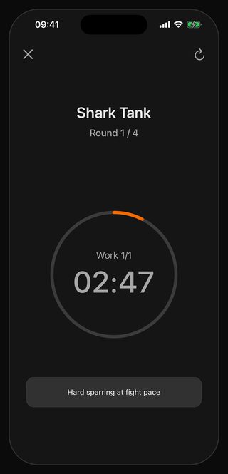 The Bell timer running Shark Tank: round 1 of 4, the single three-minute work interval with 2:47 left, the cue underneath reading Hard sparring at fight pace